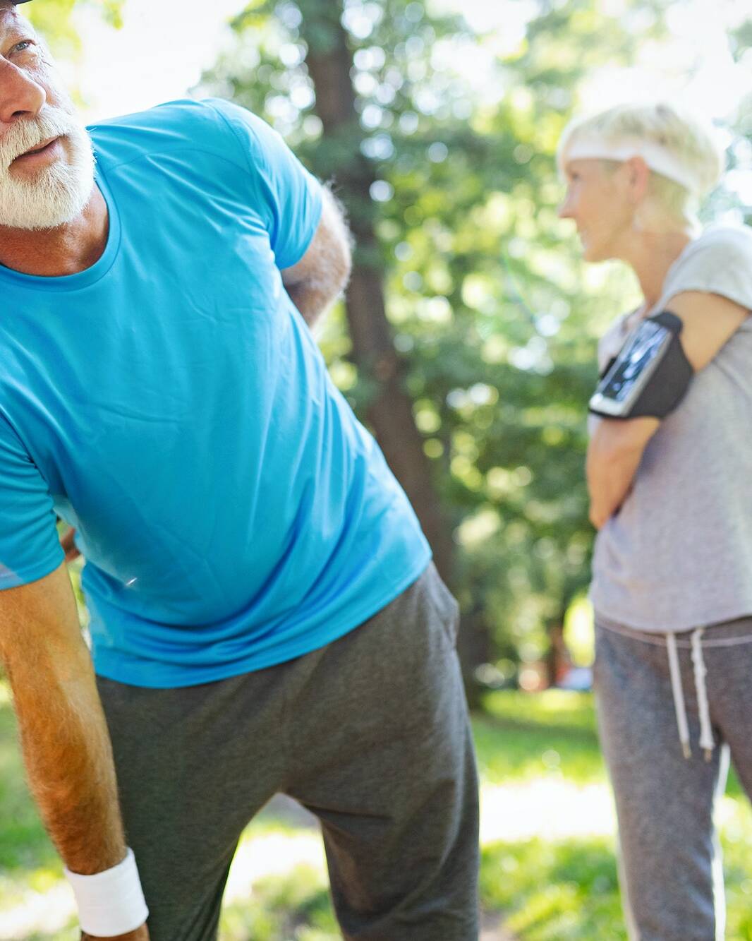 Mature man having a back pain during jogging